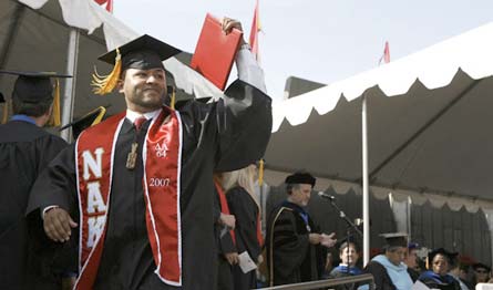 student with diploma at the CSU Stanislaus 2007 commencement ceremony